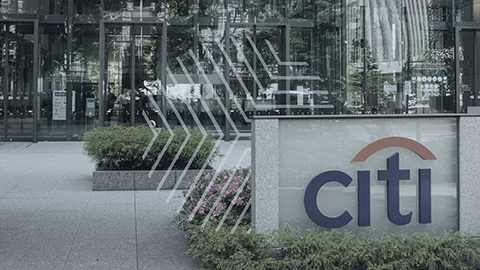 Citi bank signage in front of a modern office building, symbolizing Citi's innovation in digital assets with the launch of their tokenized deposit service.